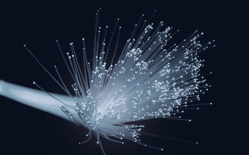 Bundle of optical fibres carrying light.