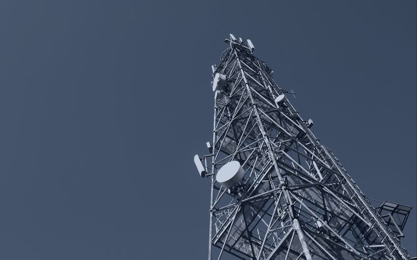 Telecommunications tower with antenna arrays.